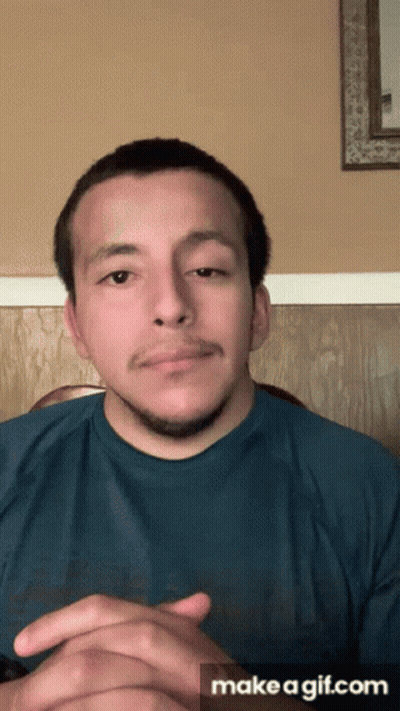 Man In Blue Shirt Hands Folded Saying Make A GIF