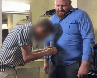 Man In Blue Shirt Helped By Striped Shirt Man GIF