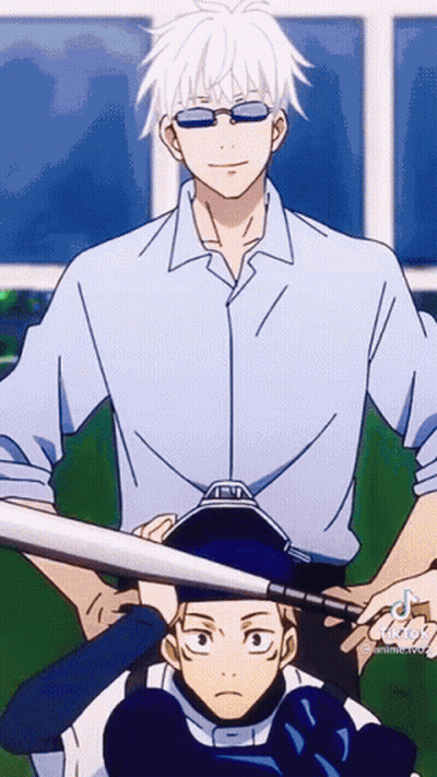 Man In Blue Shirt Holding Bat Over Another GIF