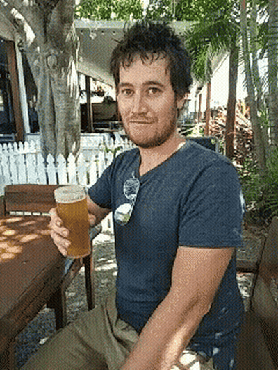 Man In Blue Shirt Holding Beer GIF