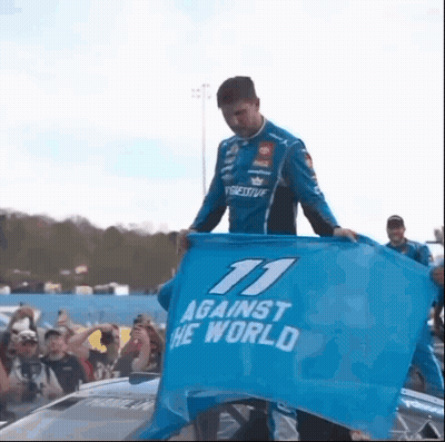Man In Blue Shirt Holding Blue Flag Against The World GIF