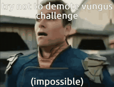 Man In Blue Shirt Holding Book Says Try Not To Demote Vungus Challenge Impossible GIF