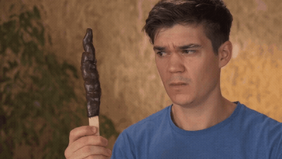 Man In Blue Shirt Holding Chocolate Ice Cream Stick GIF