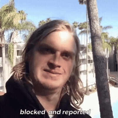 Man In Blue Shirt Holding Flashlight GIF