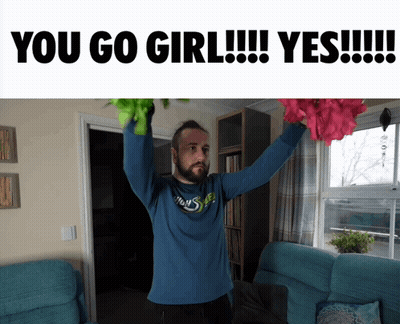 Man In Blue Shirt Holding Flowers GIF