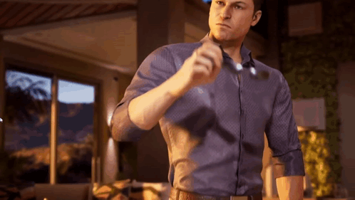 Man In Blue Shirt Holding Glasses GIF