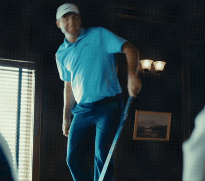 Man In Blue Shirt Holding Golf Club GIF