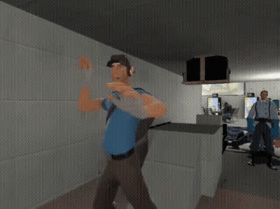 Man In Blue Shirt Holding Gun GIF