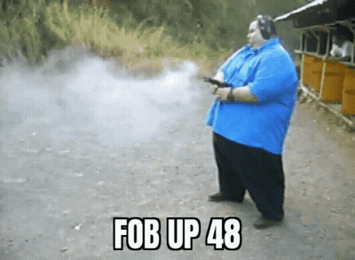 Man in Blue Shirt Holding Gun With Fob Up 48