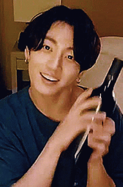 Man In Blue Shirt Holding Hair Dryer GIF