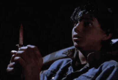 Man In Blue Shirt Holding Knife GIF