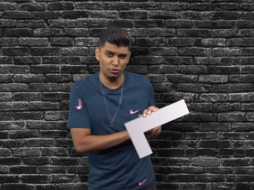 Man In Blue Shirt Holding Large L GIF