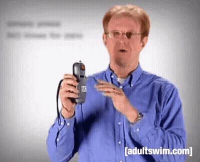Man In Blue Shirt Holding Phone Adult Swim.com GIF