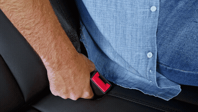 Man In Blue Shirt Holding Seat Belt GIF