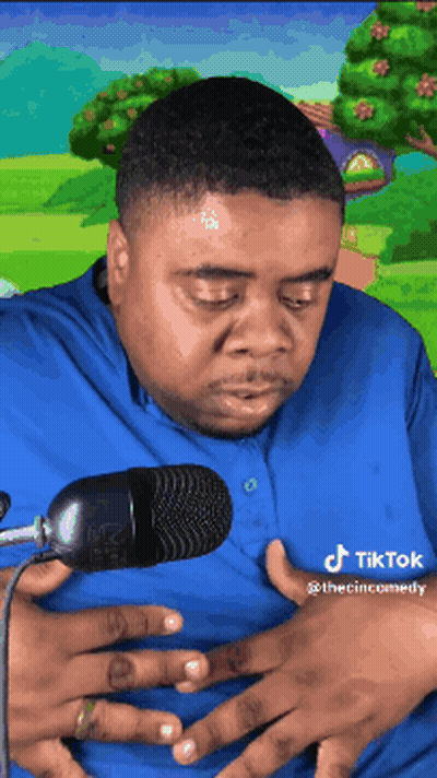Man In Blue Shirt Holding Stomach GIF
