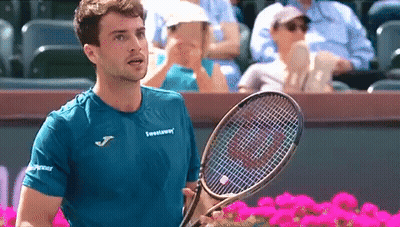 Man In Blue Shirt Holding Tennis Racquet GIF