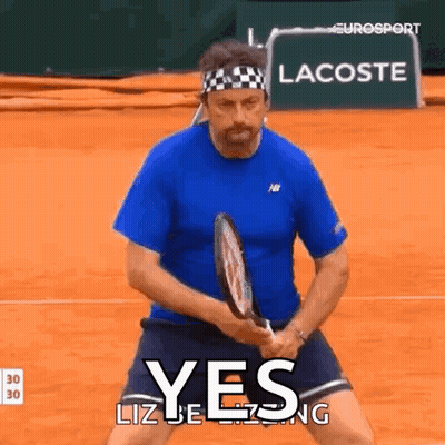 Man In Blue Shirt Holding Tennis Racquet Saying Yes GIF