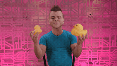 Man In Blue Shirt Holding Two Yellow Rubber Ducks GIF