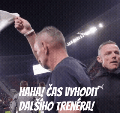 Man In Blue Shirt Holding White Flag Saying Haha Cas Vyhodit Dalsiho Trenera GIF