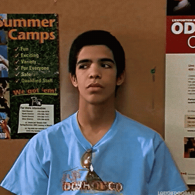 Man In Blue Shirt Holding Wood GIF