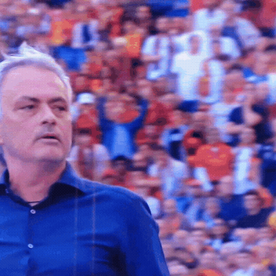 Man In Blue Shirt In Front Of Crowd GIF