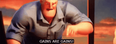 Man In Blue Shirt In Front Of Gains Are Gains Sign GIF