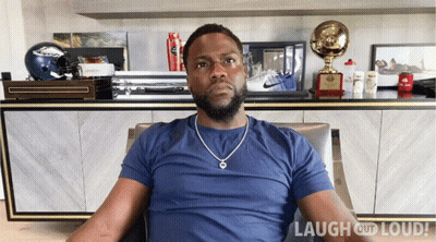Man In Blue Shirt In Front Of Laugh Out Loud Logo GIF