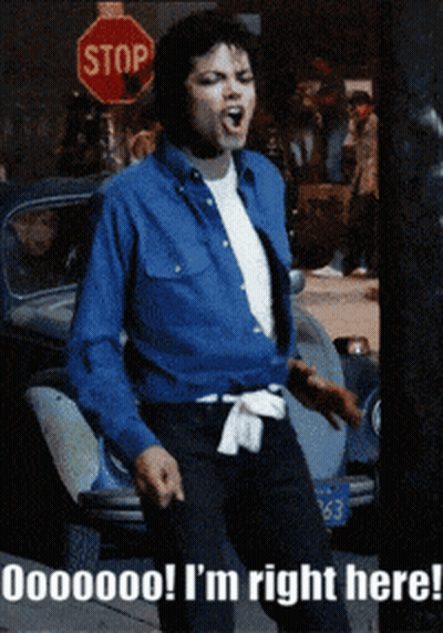 Man In Blue Shirt In Front Of Red Stop Sign GIF