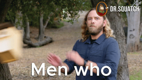 Man In Blue Shirt In Front Of Trees Men Who Are On Screen GIF