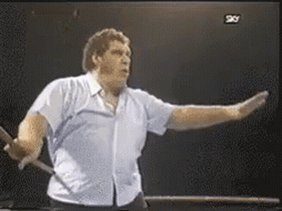 Man In Blue Shirt In Front Of TV Saying Sky GIF