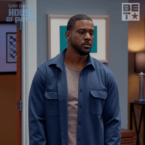 Man In Blue Shirt In Front Of Tyler Perry House Of Payne Door GIF