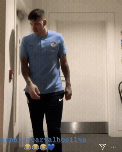 Man In Blue Shirt In Hallway Fernando Carvalhosilva GIF