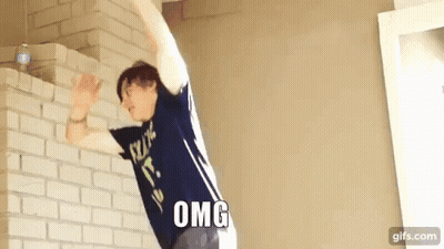 Man In Blue Shirt Jumping Over Brick Wall Omg GIF