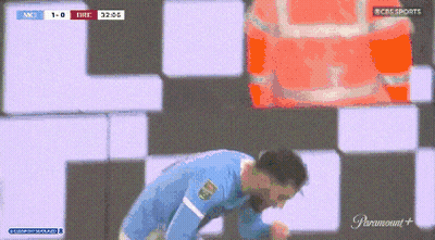 Man In Blue Shirt Kneeling Before CBS Sports Sign GIF