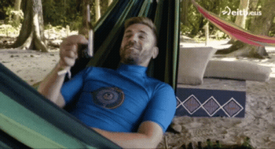 Man In Blue Shirt Laying In Hammock GIF