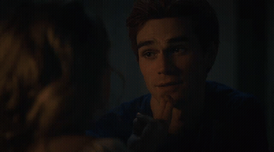 Man In Blue Shirt Looking At Woman In Dark GIF