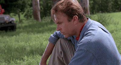 Man In Blue Shirt Looking Down GIF