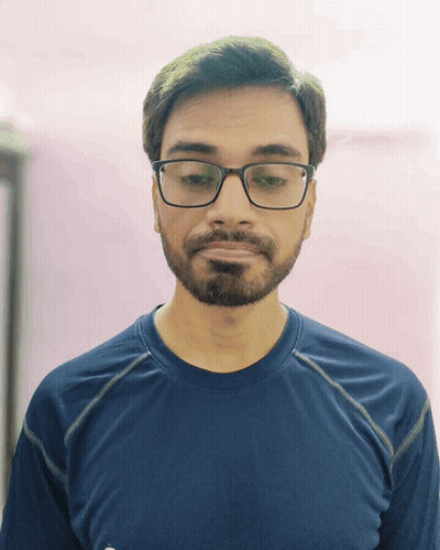 Man In Blue Shirt Looking Down GIF