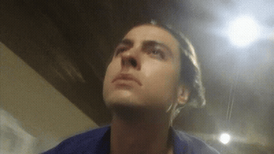 Man In Blue Shirt Looking Up GIF