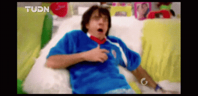 Man In Blue Shirt Lying On Couch GIF