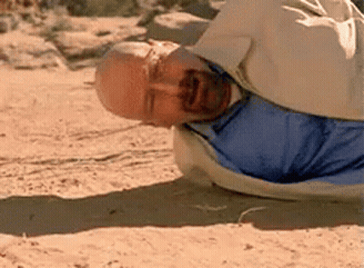 Man In Blue Shirt Lying On Sand GIF