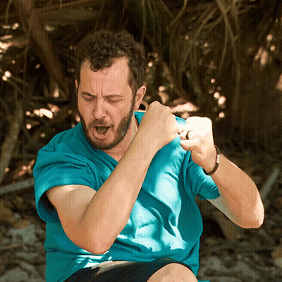 Man In Blue Shirt Making A Fist GIF