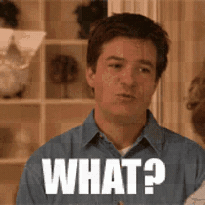 Man In Blue Shirt Making Face Saying What GIF
