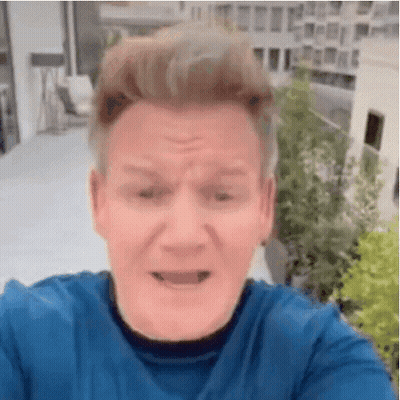 Man In Blue Shirt Making Face With Mouth Open GIF