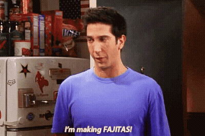 Man In Blue Shirt Making Fajitas GIF