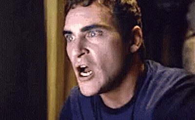 Man In Blue Shirt Making Funny Face GIF