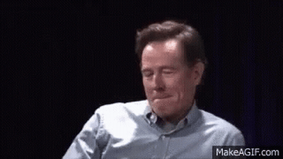 Man In Blue Shirt Making Funny Face And Waving GIF