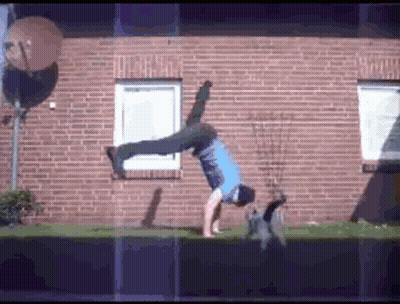 Man In Blue Shirt Making Funny Face In Dark Room GIF