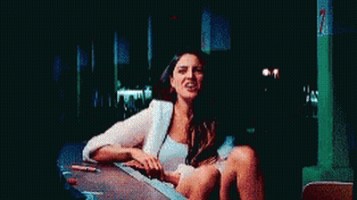 Man In Blue Shirt Making Funny Face In Dark Room GIF