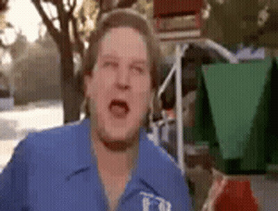 Man In Blue Shirt Making Funny Face GIF